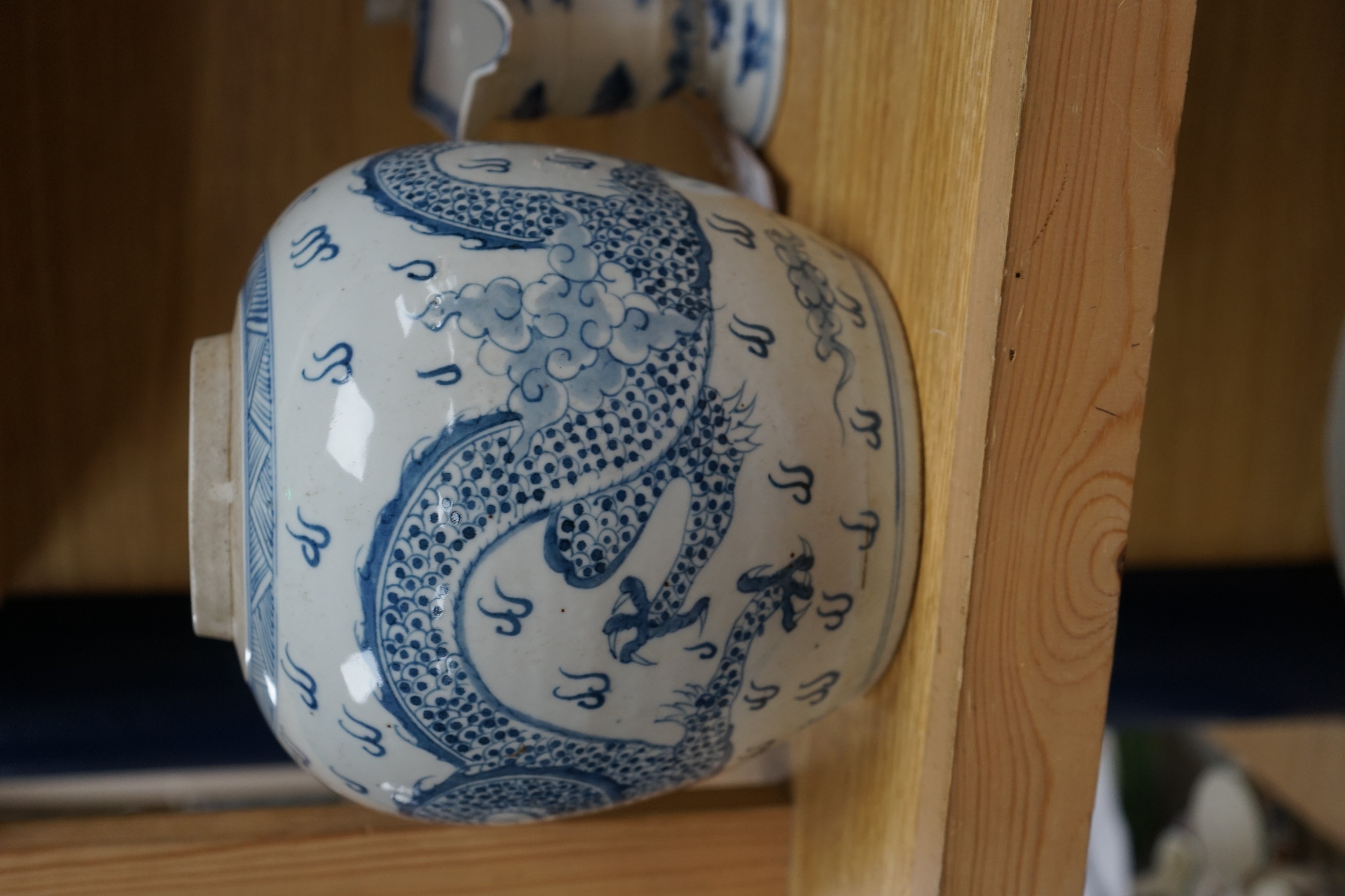 A Chinese blue and white jar, 20cm and a helmet shaped jug, 18th century and later
